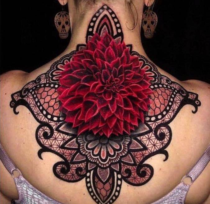 Elaborate flower tattoo on woman's neck.