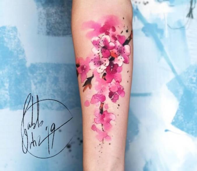 Sakura flowers tattoo by Pablo Ortiz Tattoo