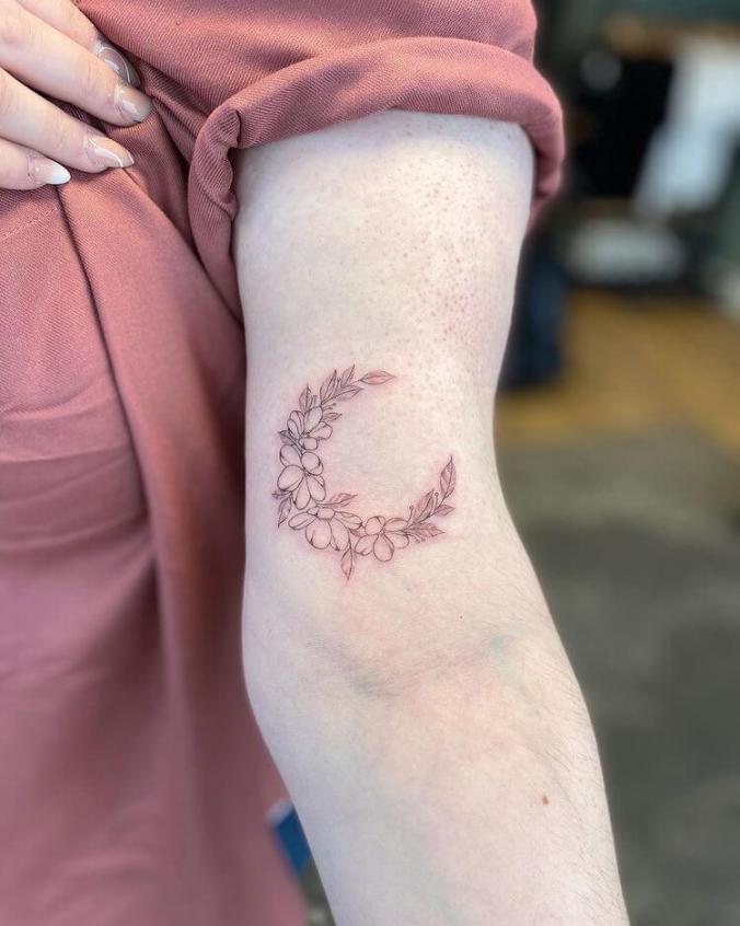 whimsical moon flower tattoo