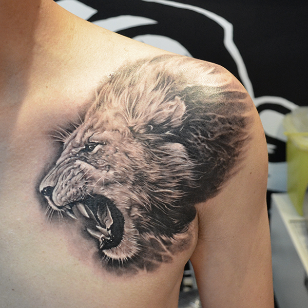Shoulder lion tattoo realistic