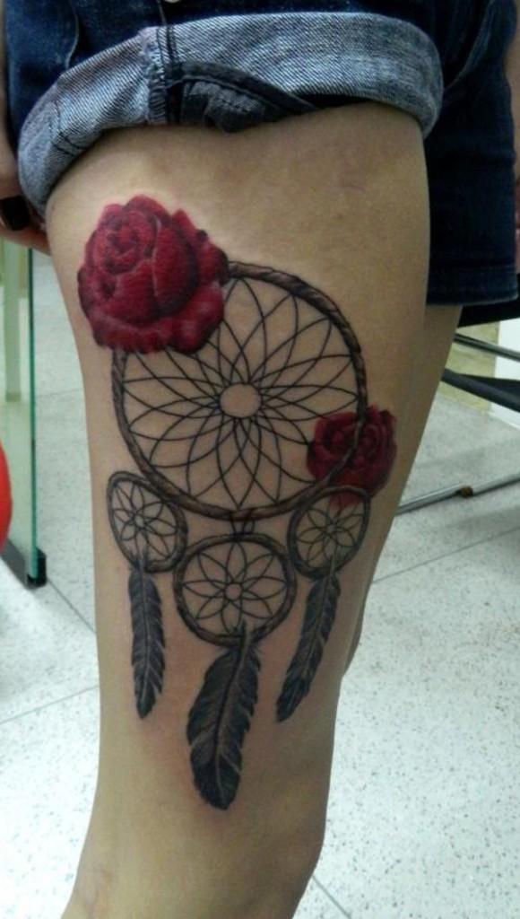 Dreamcatcher with feather thigh tattoo